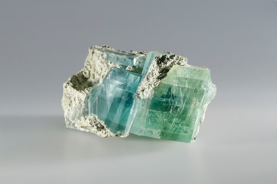 Brucite mineral magnesium hydroxide, fused green blue crystals. Museum Mineral Series. Mineralogical sample