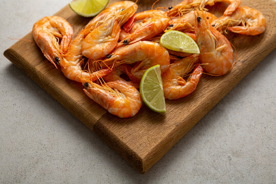Seafood shrimps on wooden boards lime close up snack food