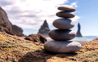 small stone pyramid at the black sand beach Reynisfjara, Iceland