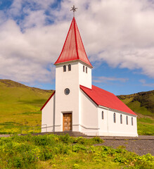 Fototapeta premium On a hill above Vik is this small church, Iceland