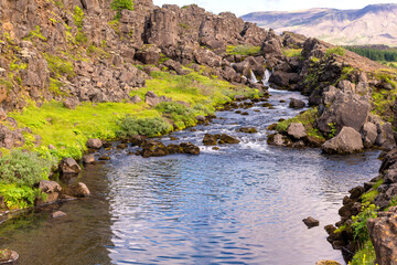 Small waterfall (Drekkingarhylur) on the Oxara River, Thingvellir National Park, Iceland