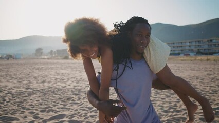 Happy family spending the day at the beach. Single dad with daughters playing and having fun