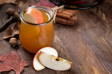 Glass of apple cider with apple slices