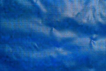 Blue banner background made of PVC plastic for design. Selective focus