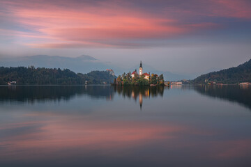 Stunning sunset view of popular tourist destination  Bled lake.