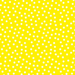 Polka dot texture, white on yellow polka dot pattern as background
