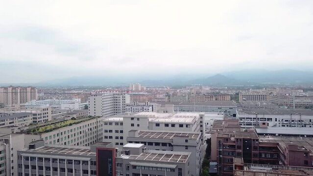 Drone Shots of Yiwu. City view, buildings, and factories on a cloudy day in Yiwu, China