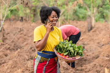 female african farmer making a phone call