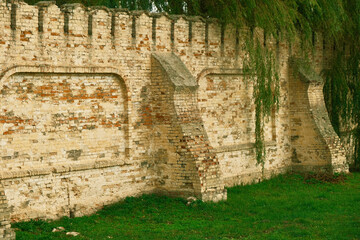 Walls and tower of an ancient castle. Brick walls and watchtower of an ancient castle. History -...