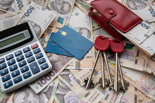 business concept sale or rent home ukraine money uah gryvnia calculator credit card and purse - Powered by Adobe