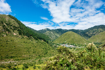 Fototapeta na wymiar A wide angle shot of a village in the mountains of Lower Himalayan region of Uttarakhand State, India.