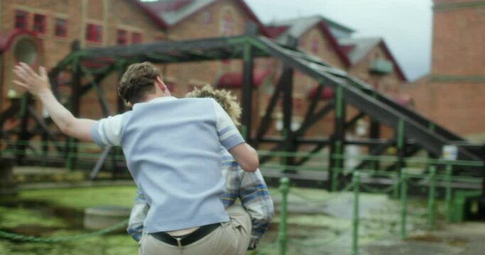 MS TS Man giving boyfriend piggyback ride