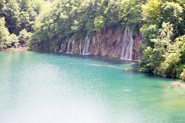 Beautiful paradise. Blue lake and waterfall in the forest, Plitvice lakes, Croatia.