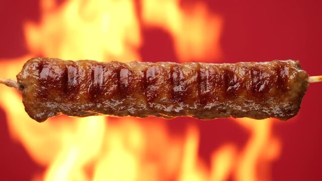 Cooking kebab on grill, open fire. Fry meat on fire