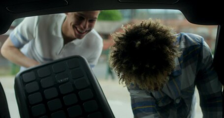 MS TS Young male couple packing luggage in car