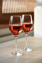 Two glasses of rose wine in an apartment