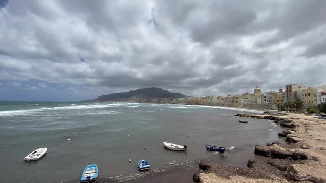 historic center of Trapani with the walls of the Tramontana and Elice in the background between clouds and wind in early summer