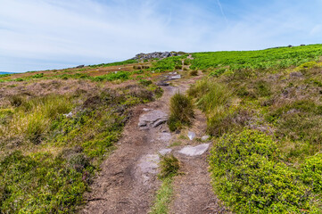A view up the path leading to the top of the Bamford Edge escarpment in summertime