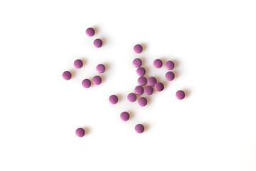 Image of violet pills isolated with shadows