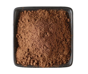 Cinnamon powder pile in ceramic bowl isolated on white, top view