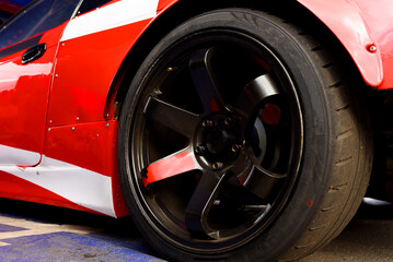 Tires of race car for driving. Drag and drift car with lower-profile tire. Racing low profile tyre...
