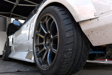 Tires of race car for driving. Drag and drift car with lower-profile tire. Racing low profile tyre...