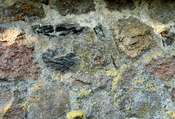 Stone background, texture. Wall stone background. Rock with cracks and layers. Rough rocky texture of mountains. Mining and geology. Stone road, pavement, footpath. Texture of the marble wall.