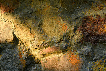 Stone background, texture. Wall stone background. Rock with cracks and layers. Rough rocky texture of mountains. Mining and geology. Stone road, pavement, footpath. Texture of the marble wall.