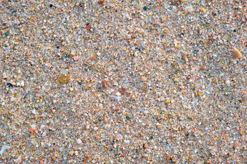 Flat view of clean yellow sand surface covering seaside beach. Sandy texture