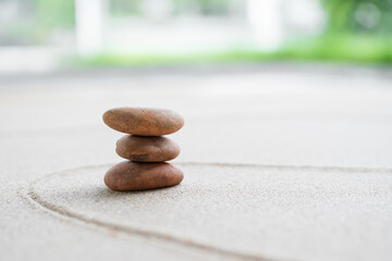 Japanese Zen Garden with Pebble with Line on Sand.mini Stone on Beach backgrond Top View and nobody.Ciircle Rock Balance Japan on nature.Simplicity Purity life.Relax Aromatherapy Spa and Yoga.Buddhism