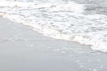 Soft waves on a beautiful beach in the evening.