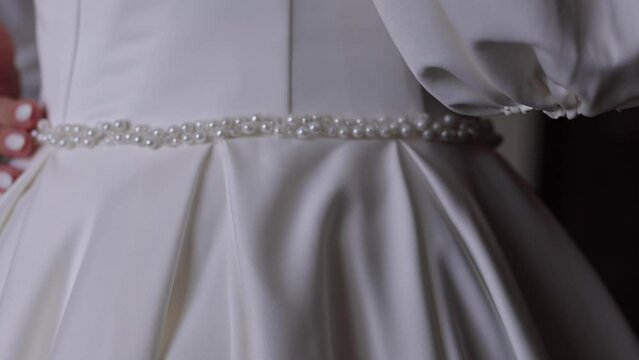 Beautiful white bride's dress, close-up on a mannequin