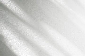 Abstract shadow and striped diagonal light background on white wall  from window,  architecture dark gray and sunshine diagonal geometric effect overlay backdrop