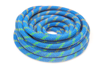 durable colored rope for climbing equipment on a white background. knot of braided cable. item for tourism and travel © photosaint