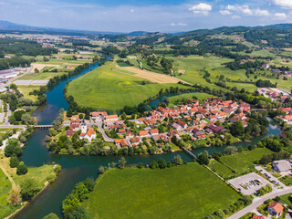 Fototapeta na wymiar Kostanjevica na Krki Medieval Town Surrounded by Krka River, Slovenia, Europe. Aerial view.