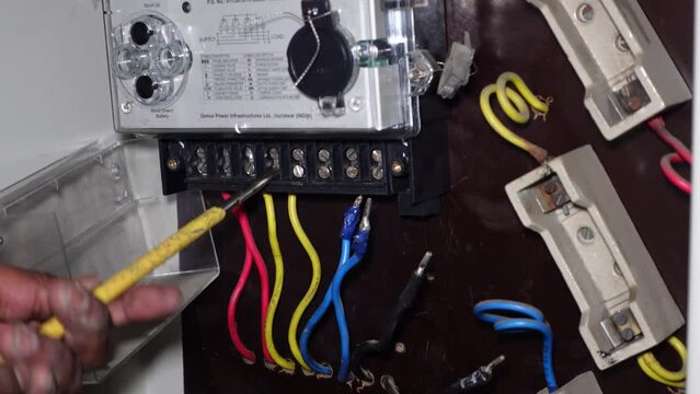 Bangalore, India 12th August 2022: Replacement of a faulty meter to a new Digital Meter assigned by Bescom - Bangalore Electricity Supply Company Limited. Indian power distribution supply companies.