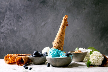 Turquoise ice cream in waffle cones