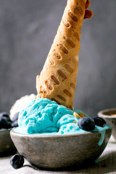 Turquoise ice cream in waffle cones