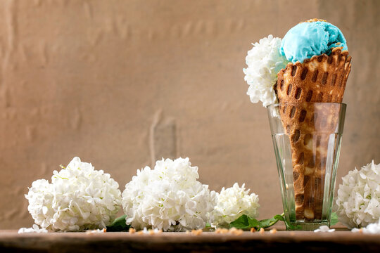 Turquoise ice cream in waffle cone