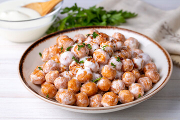 Traditional Turkish food, Mirik Kofte made from bulgur, onion and eggs with yoghurt