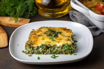 Baked Spinach with cheese delicious Italian food cuisine. Spinach gratin.