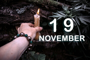 calendar date on the background of an esoteric spiritual ritual. November 19 is the twenty-second...
