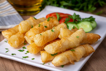 Fried pastry wrapped in cheese in phyllo. Pie in the form of a roll. Turkish name; Kalem borek - sigara boregi