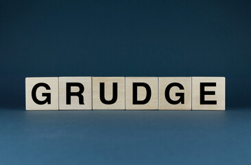 Grudge. Cubes form the word Grudge