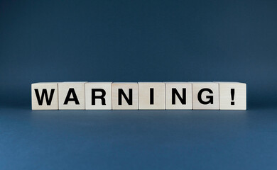 Warning. Cubes form the word Warning