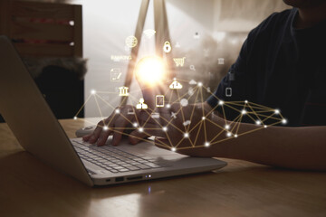 man use laptop computer with idea by light bulb creativity in innovation technology and imagination for solution concept