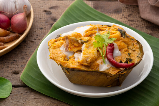 Steamed Fish in Red Curry Mousse in Banana Leaf bowl
