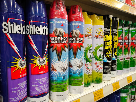 CHERAS, MALAYSIA -JUNE 6, 2022: Various brands of aerosol-type insecticides in commercial cans. Displayed for sale. Labeled with a price tag.