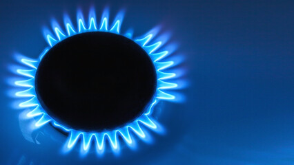 top view of burner with lit natural gas with space for text on blue background - obrazy, fototapety, plakaty