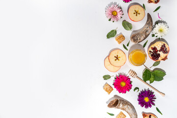 Happy Rosh Hashanah background. jewish New Year Rosh Hashana holiday postcard greeting background, with traditional religion symbols - apple, honey, pomegranate, shofar, flatlay copy space